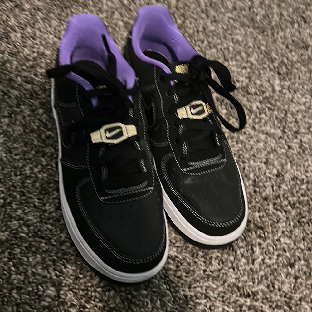 Black and purple Nikes with a hint of gold